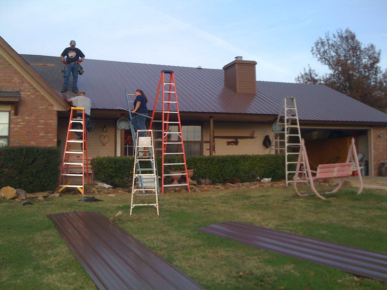 Roofers working on a custom home in Tahlequah, OK.